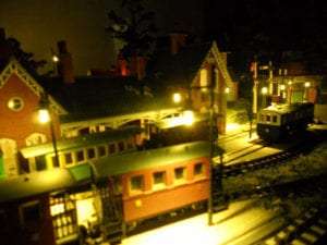 model railroad with lamp posts at night time